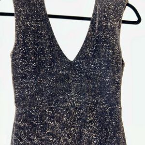 Women’s size small black cocktail mini dress with gold threading & lining.